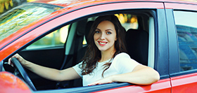 Happy Smiling Woman Driver Behind The Wheel Red Car